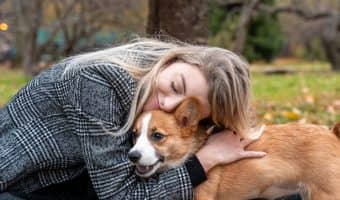 woman hugging her dog for support