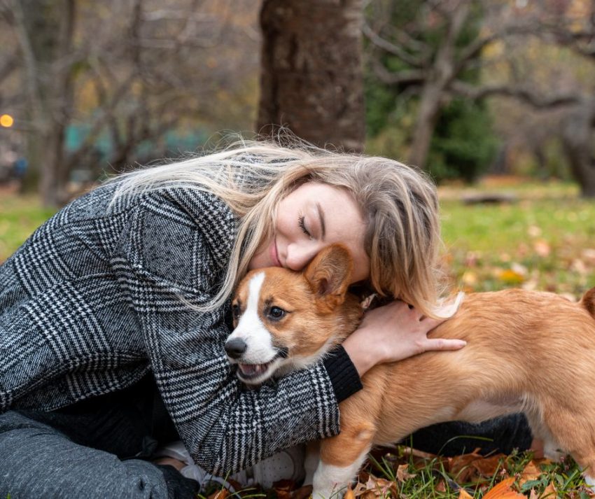 woman hugging her dog for support